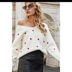 Stylish Off-Shoulder White Sweater with Red Heart Accents